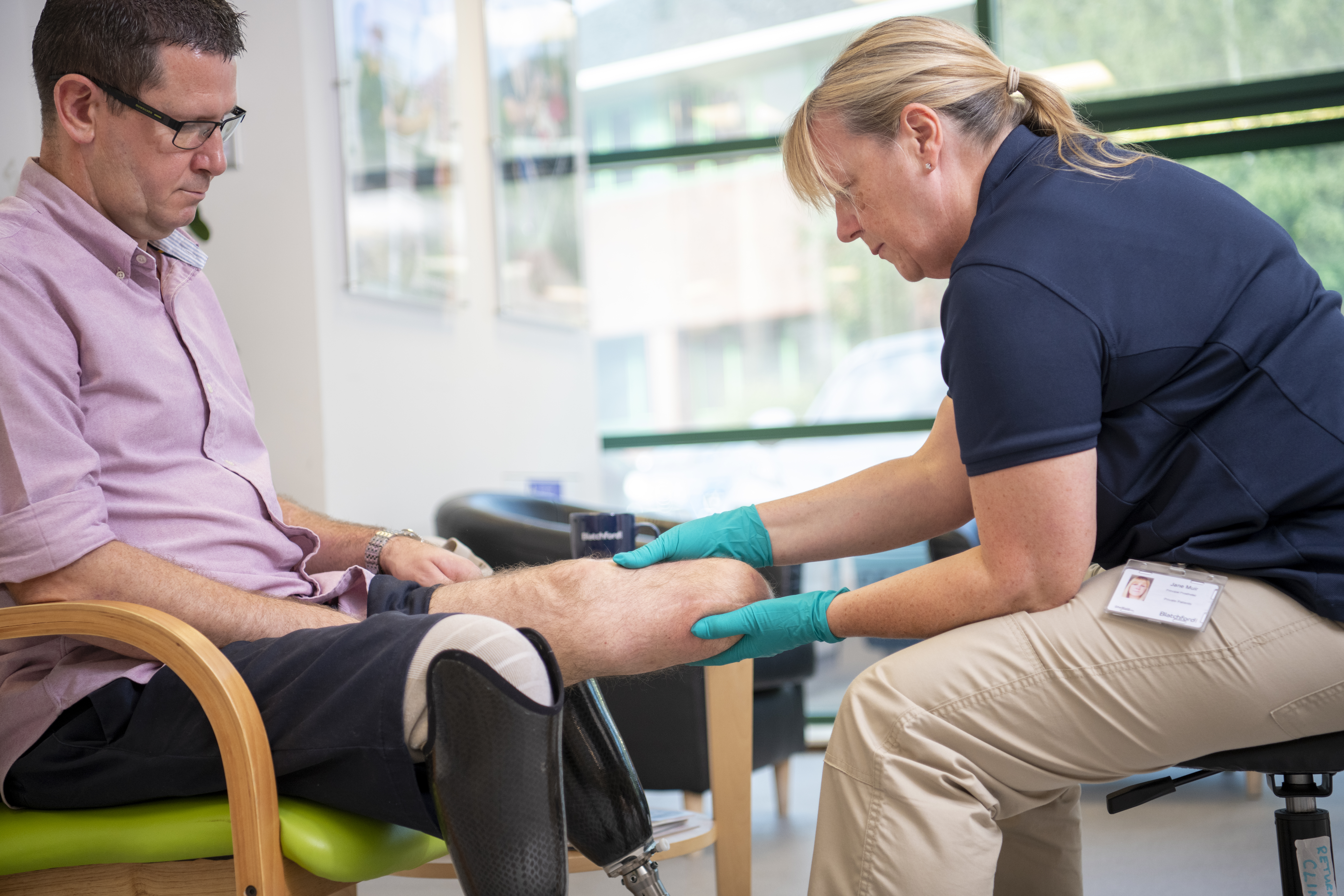 Image of Principal Prosthetist Jane Muir treating bi-lateral below the knee amputee Steve North